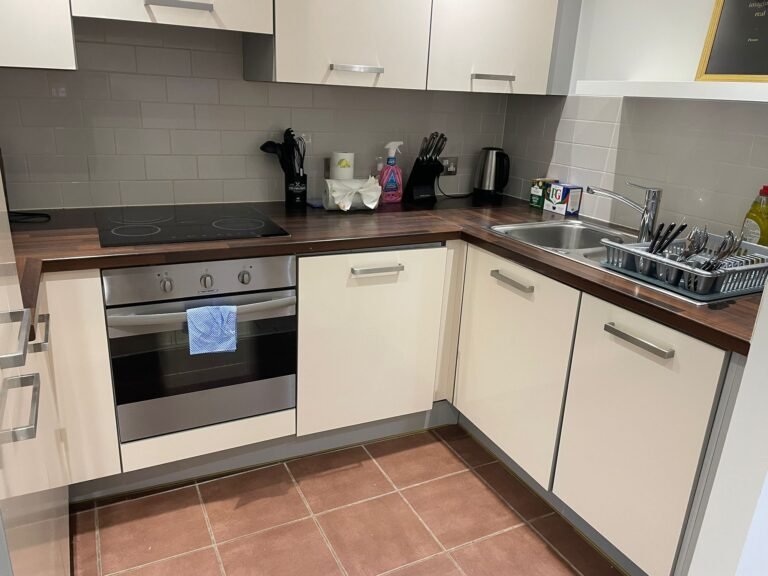 Airbnb kitchen turnaround — sink, worktop and hob polished.